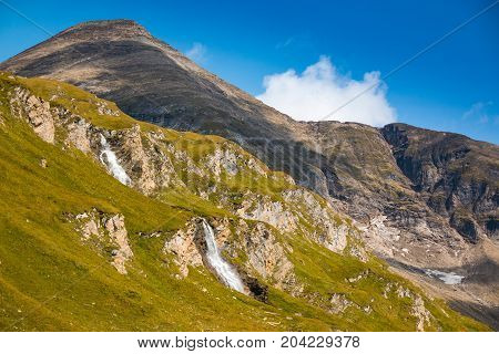 Waterfall next to Grossglockner High Alpine road in Hohe Tauern National Park, Austria