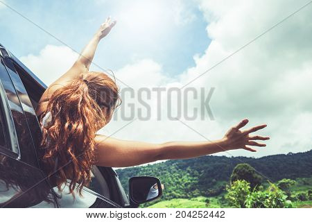 Asian women travel relax in the holiday. driving a car traveling happily.