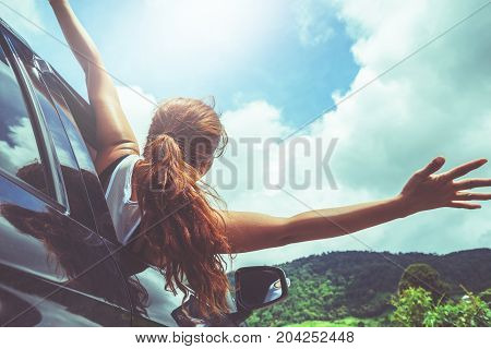 Asian women travel relax in the holiday. driving a car traveling happily.