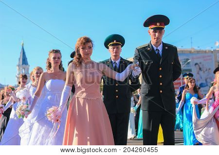 Zhytomyr, Ukraine - MAY 19, 2014: Military and civil people dancing at the ball at midday