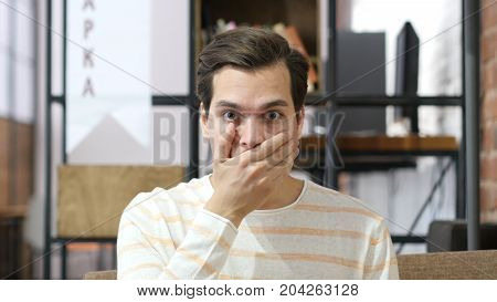Young Man With A Shocked Facial Expression , Seeing Bad News