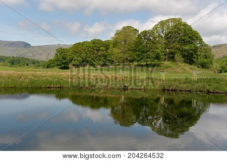 Langdale Pikes reflected in River Brathay, English Lake District