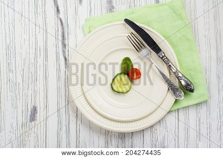 Small portion of food. Anorexia or unhealthy diet concept. Top view