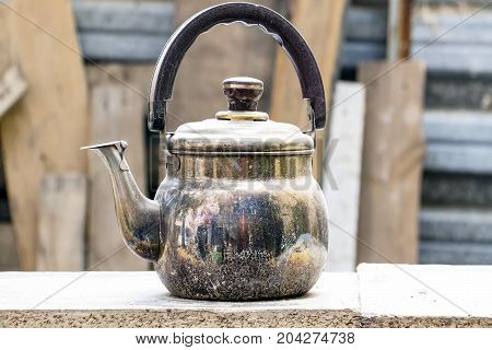 The old copper kettle on a natural background