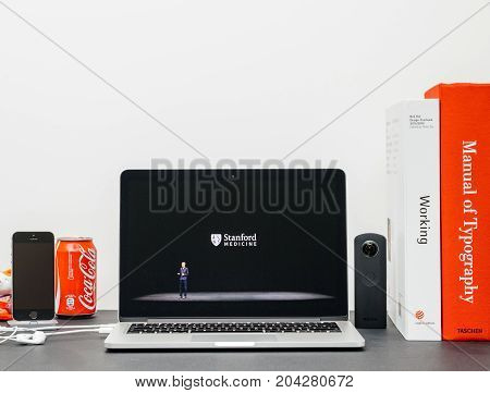 PARIS FRANCE - SEP 13 2017: Minimalist creative room Safari Browser open on MacBook Pro laptop showcasing Apple Keynote website - Apple COO Jeff Williams presenting the Apple Watch 3 Stanford Medicine cooperation