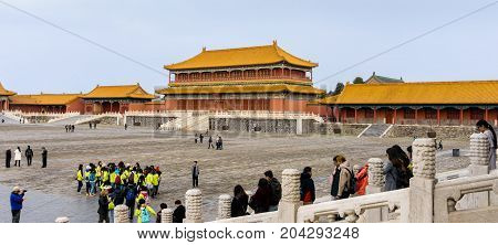 Beijing, China - Oct 30, 2016: At the Gate of Supreme Harmony (Taihemen), Forbidden City (Gu Gong, Palace Museum). Tower of State Benevolence is the middle building before a large central courtyard.