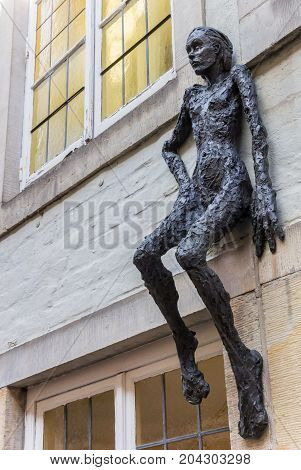 BREMEN, GERMANY - AUGUST 23, 2017: Sculpture of a woman on a facade in the Schnoor district of Bremen, Germany