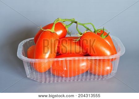 Tomatoes San Marzano, Campania, italy

Group of tomatoes San Marzano, bunch cluster, still life on gray-blue background