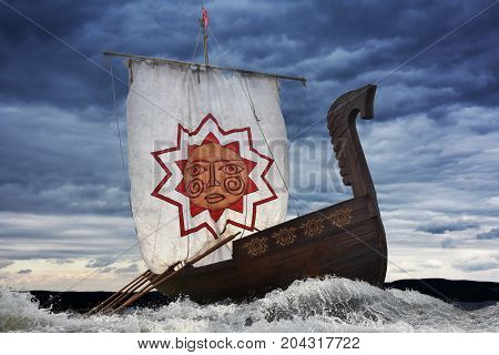 Ancient wooden sailboat bravely defies the elements
