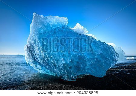 blue iceberg in Jokulsarlon a large glacier lake in south Iceland selective focus
