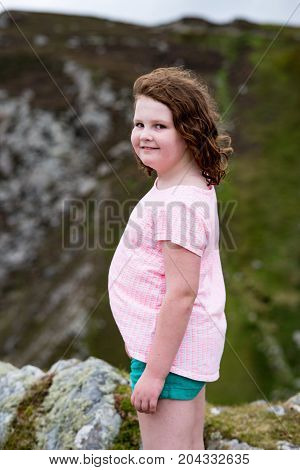 View of Girl looking out over Slieve League Cliffs, County Donegal, Ireland