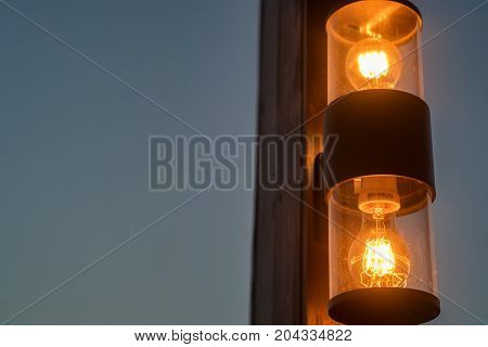 Close up working retro street light in dark evening