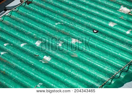 pollution source , wavy roof cover on pollutant eternit panels .