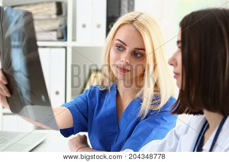 Group Of Doctors Hold In Hand Xray Photography
