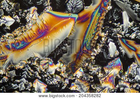 colorful microscopic shot of Sodium nitrate microcrystals in polarized light