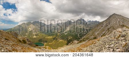 Alpine lake Popradske pleso in the morning with a great view on Tatra mountains.