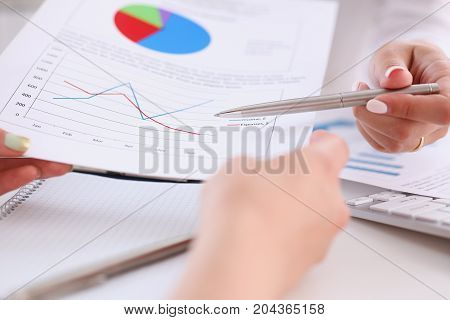 Businesswoman Holding A Silver Pen In Her Hand