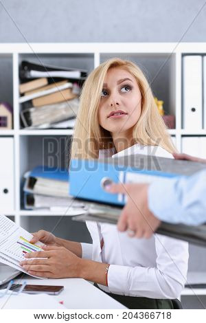 Female Employee Show Pack Of Documents To Manager