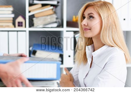 Female Employee Show Pack Of Documents To Manager