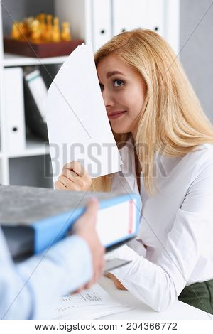 Female Employee Show Pack Of Documents To Manager