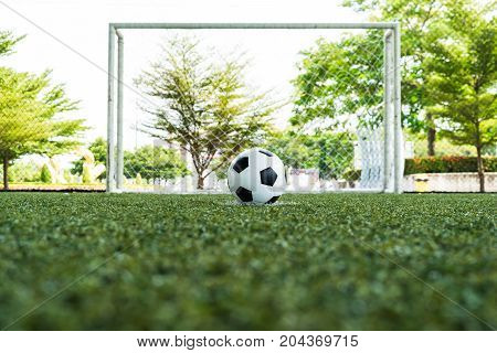 football field ball on green grass soccer field background texture