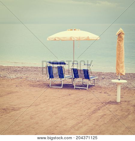 Beach Umbrella and Sun Bed in the Sandy Coast near the Italian City of Minori Instagram Effect