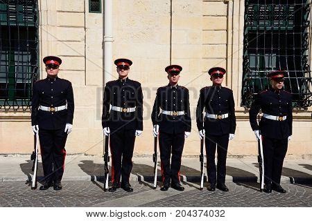 VALLETTA, MALTA - MARCH 30, 2017 - Uniformed soldiers on parade outside the Auberge de Castille for a European Union conference in Castille Square Valletta Malta Europe, March 30, 2017.