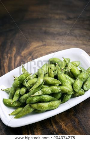 portion of salted japanese edamame green beans snack starter