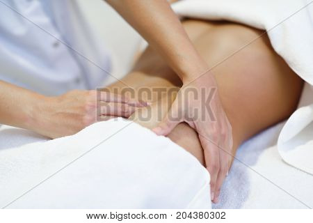 Woman Receiving A Belly Massage At Spa Salon