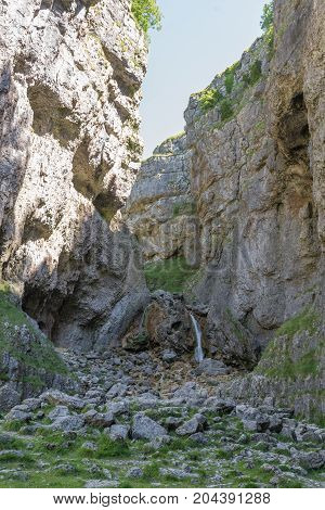 Gordale Scar In Yorkshire. Waterfall At The End Of The Limestone Gorge