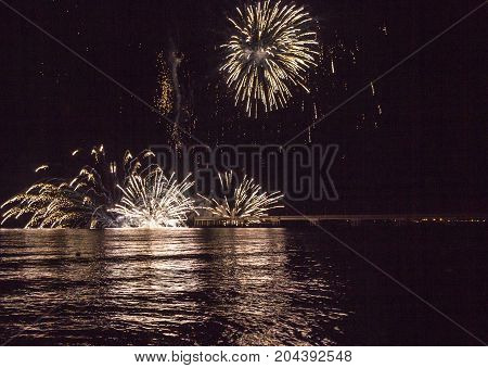 MARINA DI MASSA, ITALY - AUGUST 22 2015: Firework by the sea in Marina di Massa Italy from its famous pier