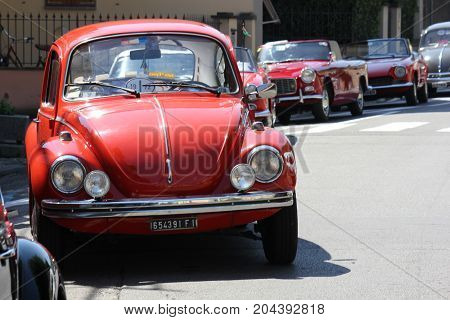 LASTRA A SIGNA, ITALY - AUGUST 30 2015: Vintage red beetle parked on the street in Lastra a Signa Florence