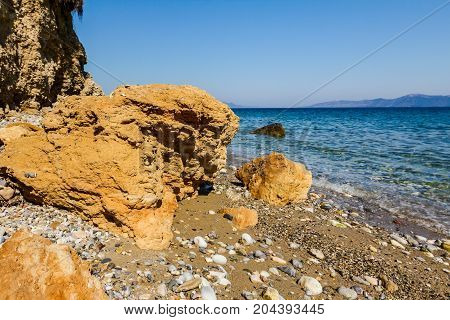 Coastal erosion of the cliffs is created by wind and rain erosion.