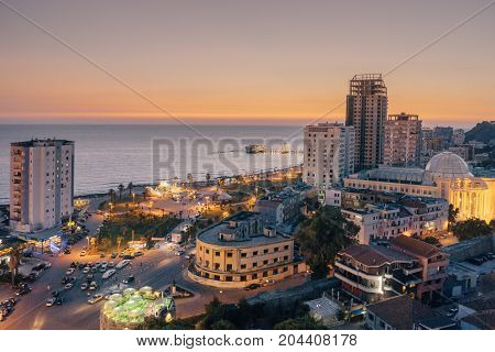 ALBANIA DURRES - September 22 2015: View from above on the embankment of the seaside town of Durres located on the Adriatic coast. Sunset sunset overlooking the Venetian Tower with a cafe on the roof.