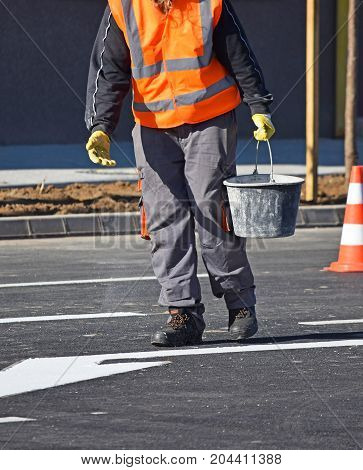 Worker at the road cosntruction in the city