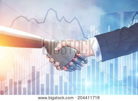 Close up of a businessman in a suit and a robot shaking hands. Blurred background. Graphs. Concept of innovation in business. Toned image double exposure