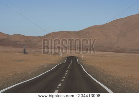 Road through the Atacama Desert to the historic coastal town of Pisagua in the Tarapaca Region of northern Chile.