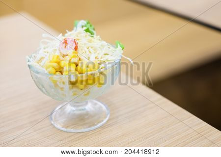 Vegetable (tomato cabbage & corn) salad serve in clear bowl for homemade food background or texture - Healthy & diet concept.