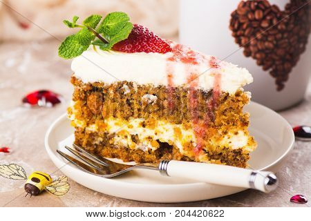 Carrot cake with strawberry sauce and mint. Valentines day dessert. Selective focus