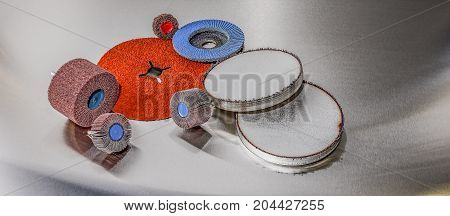 discs abrasive flap wheels on metallic background. abrasive discs and metal before processing