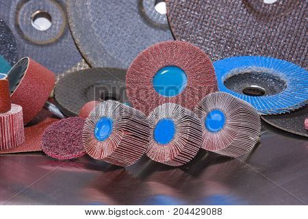 A pile of color abrasive sandpaper for metal working sandpaper for metal working