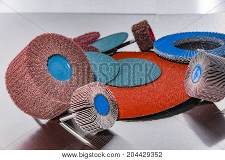 A pile of color abrasive sandpaper for metal working sandpaper for metal working