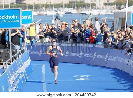 STOCKHOLM - AUG 26 2017: Female triathlete Ashleigh Gentle running at the finish in the Women's ITU World Triathlon series event August 26 2017 in Stockholm Sweden