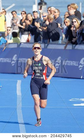 STOCKHOLM - AUG 26 2017: Female triathlete Ashleigh Gentle running at the finish in the Women's ITU World Triathlon series event August 26 2017 in Stockholm Sweden
