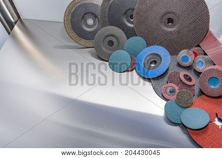 A pile of color abrasive sandpaper for metal working sandpaper for metal working
