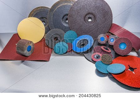 A pile of color abrasive sandpaper for metal working sandpaper for metal working