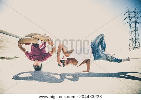 Two bbys ding some stunts - Street artist breakdancing outdrs