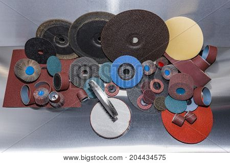 A pile of color abrasive sandpaper for metal working sandpaper for metal working