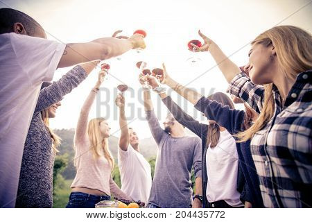 Group of friends at restaurant outdoors - People having dinner in a home garden