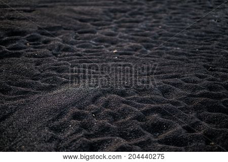 Volcanic rock on black sand beach at Vik in southern Iceland